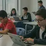 Students using AI tools in a modern US classroom