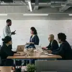 Diverse entrepreneurs collaborating in a modern co-working space, representing US startup accelerator applicants.